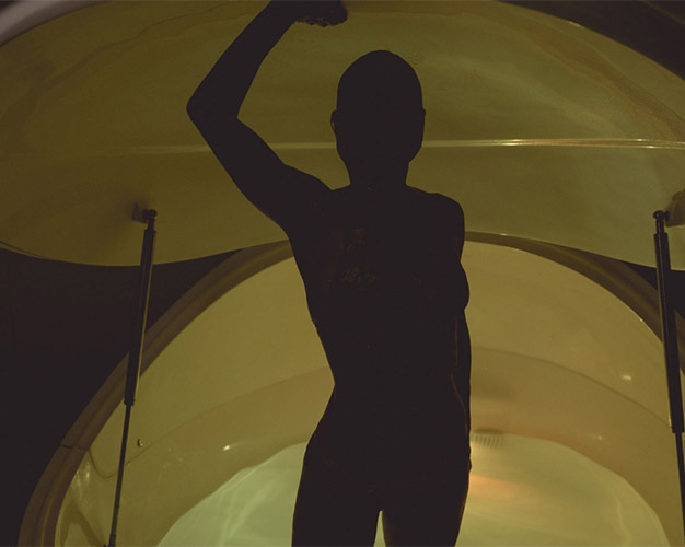 Person relaxing in a float tank for stress relief
