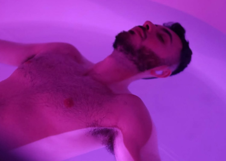 Person floating in a salt water sensory deprivation tank